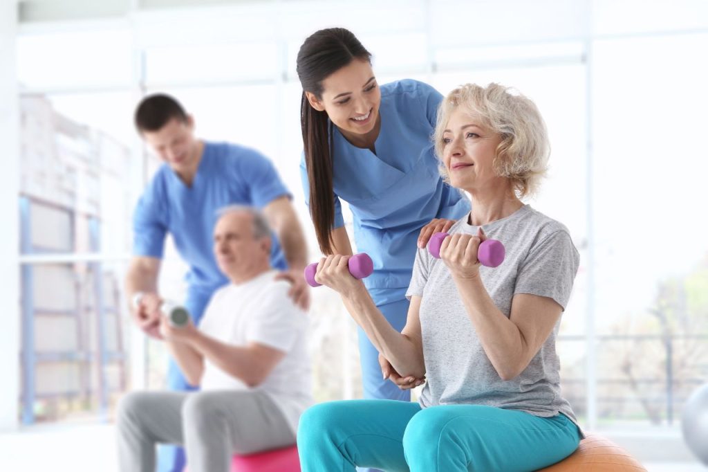 Physiotaherapist working with patient on exercise_rehabilitation