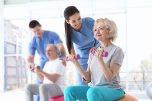 Physiotaherapist working with patient on exercise_rehabilitation