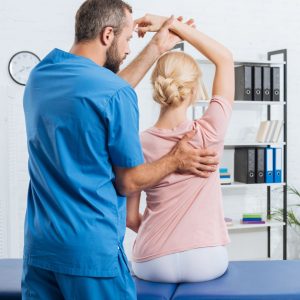 physiotherapist assessing patient